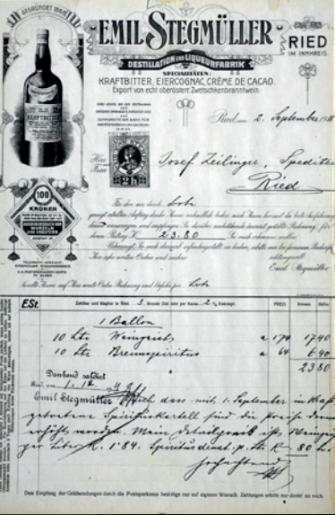 Historischer Geschäftsbeleg von Emil Stegmüller in Ried mit illustriertem Briefkopf, Flaschenmotiv und handschriftlichen Einträgen.